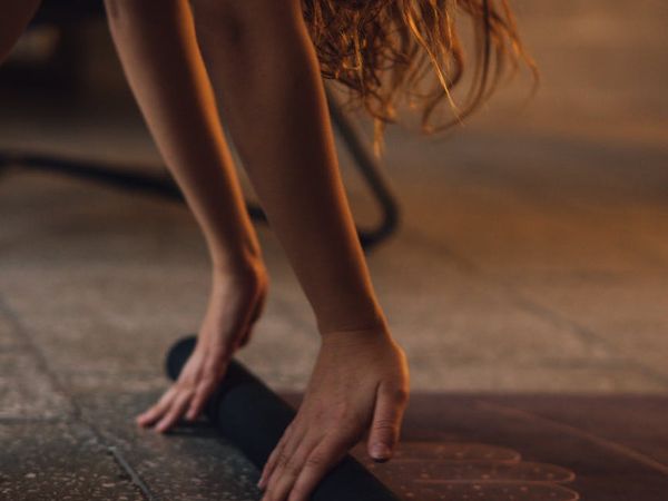 A calm and minimalist space prepared for a yoga session.