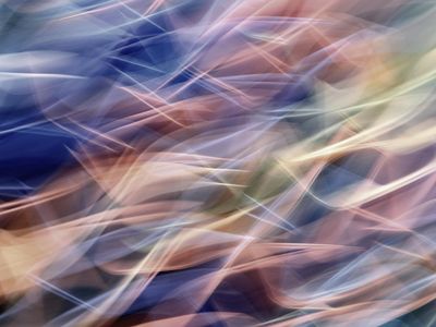 Abstract light trails suggesting smooth fluid movement.